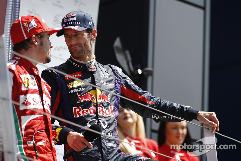 Fernando Alonso Ferrari talks with Mark Webber Red Bull Racing on the podium 