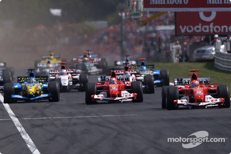 Start: Michael Schumacher takes lead ve Rubens Barrichello ve Fernando Alonso