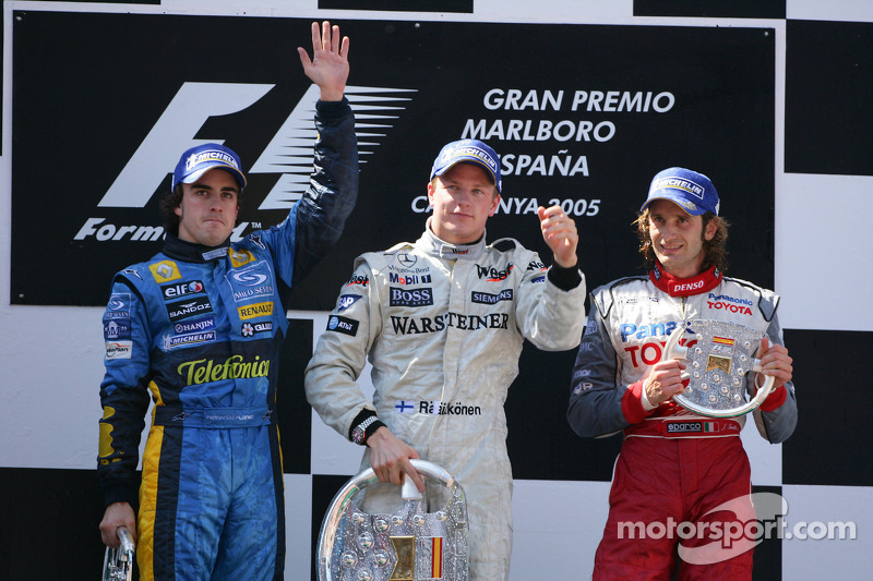 Podium: race winner Kimi Raikkonen with Fernando Alonso and Jarno Trulli