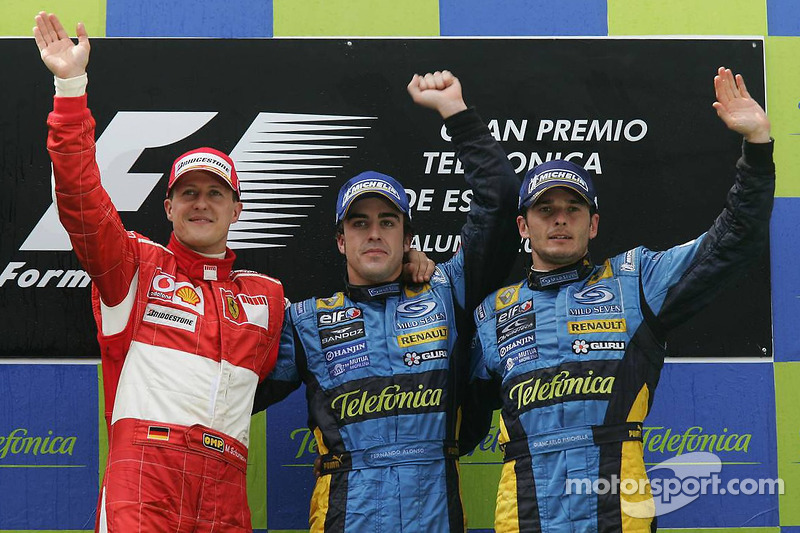 Podium: race winner Fernando Alonso celebrates with Michael Schumacher and Giancarlo Fisichella