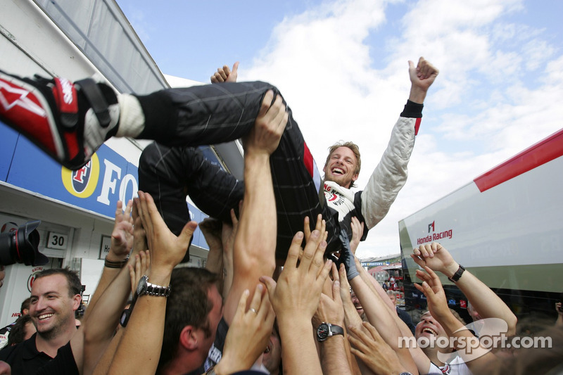 Race winner Jenson Button celebrates