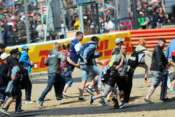 Fans invade the circuit at the end of the race.