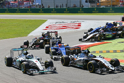 Nico Rosberg, Mercedes AMG F1 W06 and Sergio Perez, Sahara Force India F1 VJM08 at the start of the race