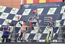 Подиум: второе место - Дани Педроса, Repsol Honda Team, победитель - Хорхе Лоренсо и третье место - Валентино Росси, Yamaha Factory Racing