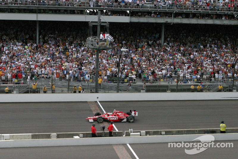 Race winner Scott Dixon takes the checkered flag