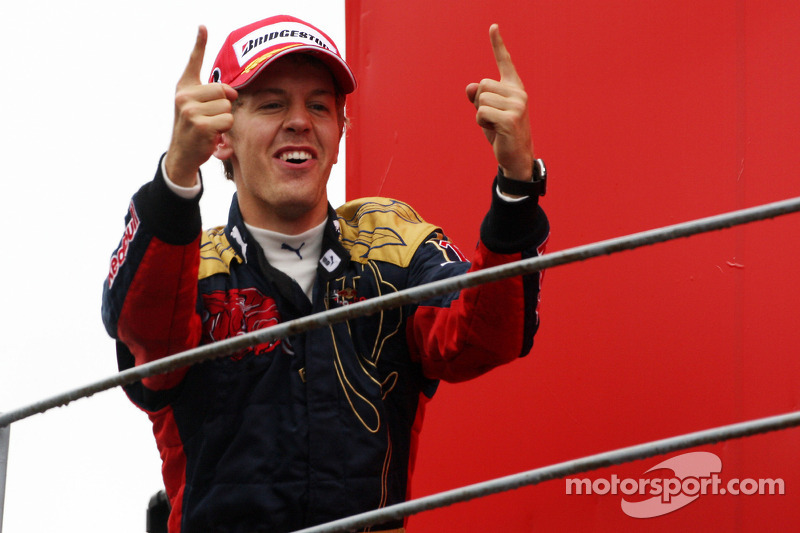 Podium: race winner Sebastian Vettel celebrates