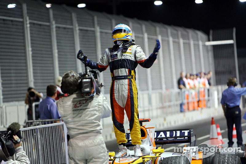 Race winner Fernando Alonso celebrates