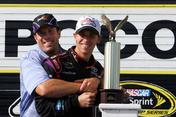 Victory lane: race winner Denny Hamlin, Joe Gibbs Racing Toyota, celebrates with J.D. Gibbs